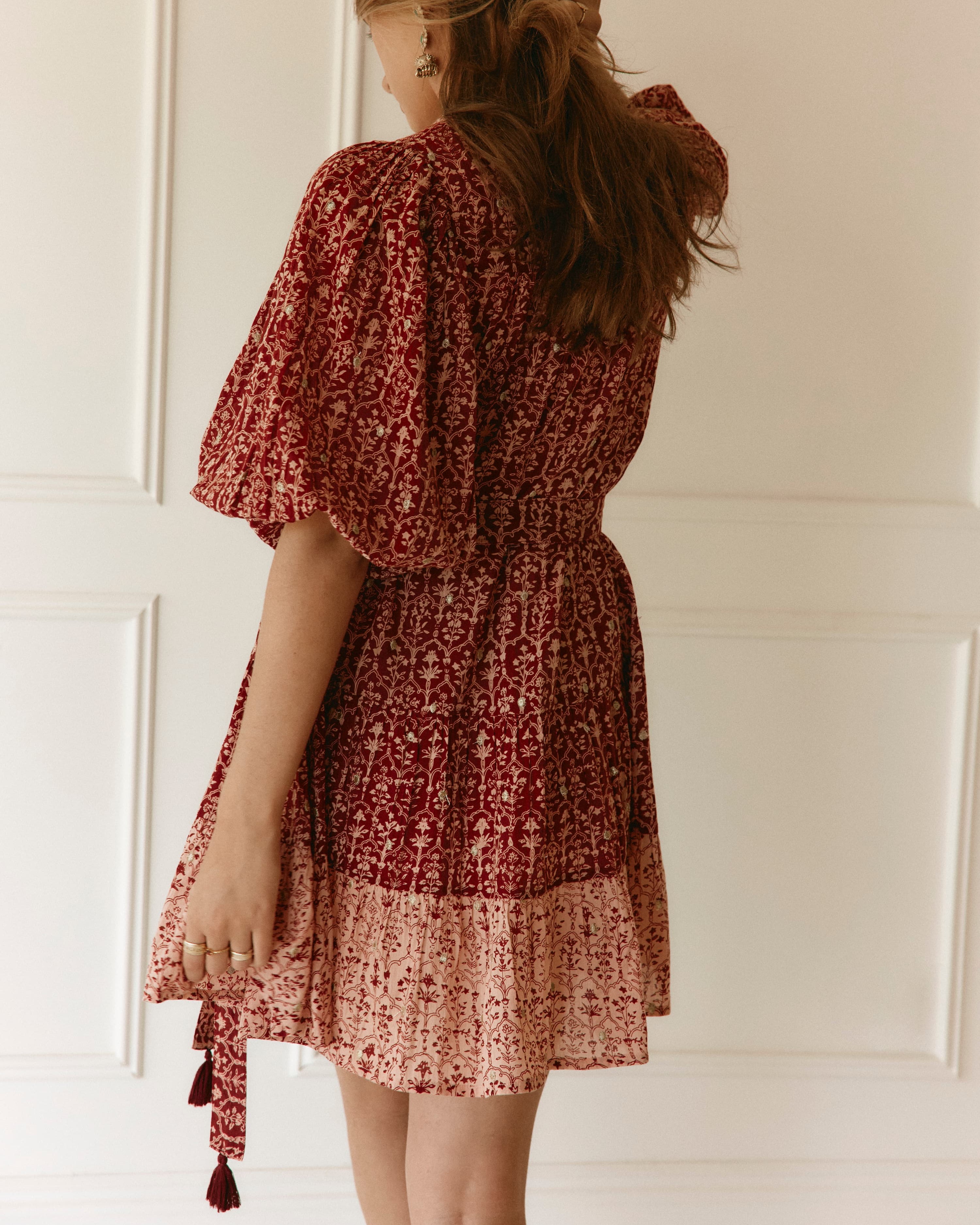 Lakoen model wears our Emile Short dress in soft printed cotton, in rose pink & merlot hues, with delicate gold lurex embroidered dots - slow fashion - hand-crafted - ethically made