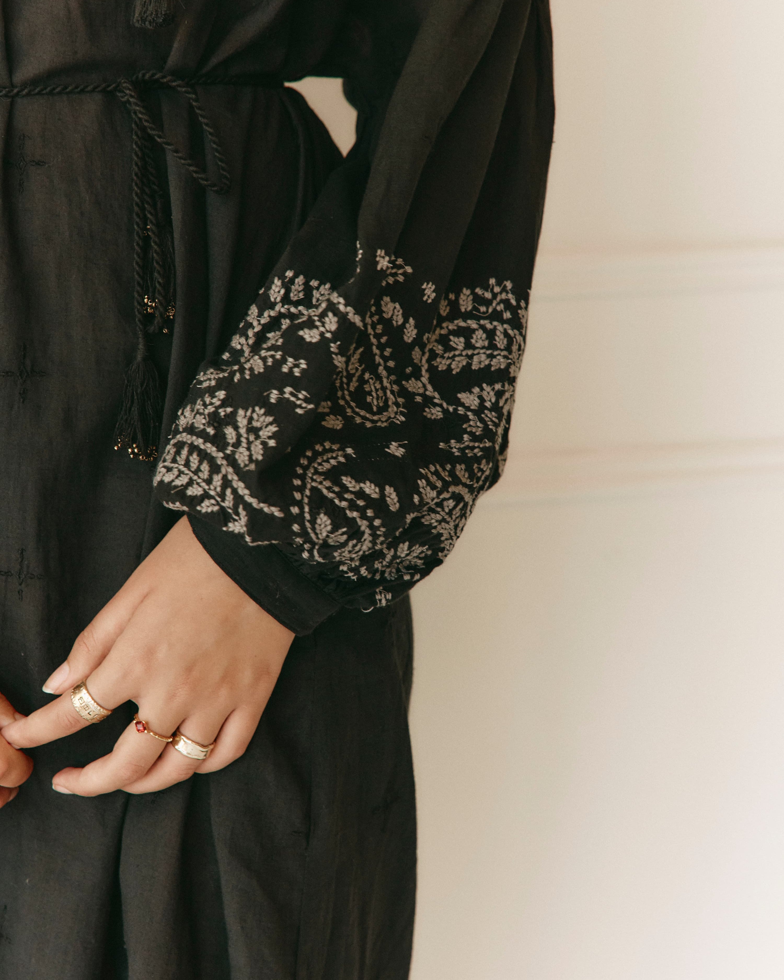 Lakoen Celeste caftan style Dress in black cotton with off white paisley embroidery and full bishop sleeves