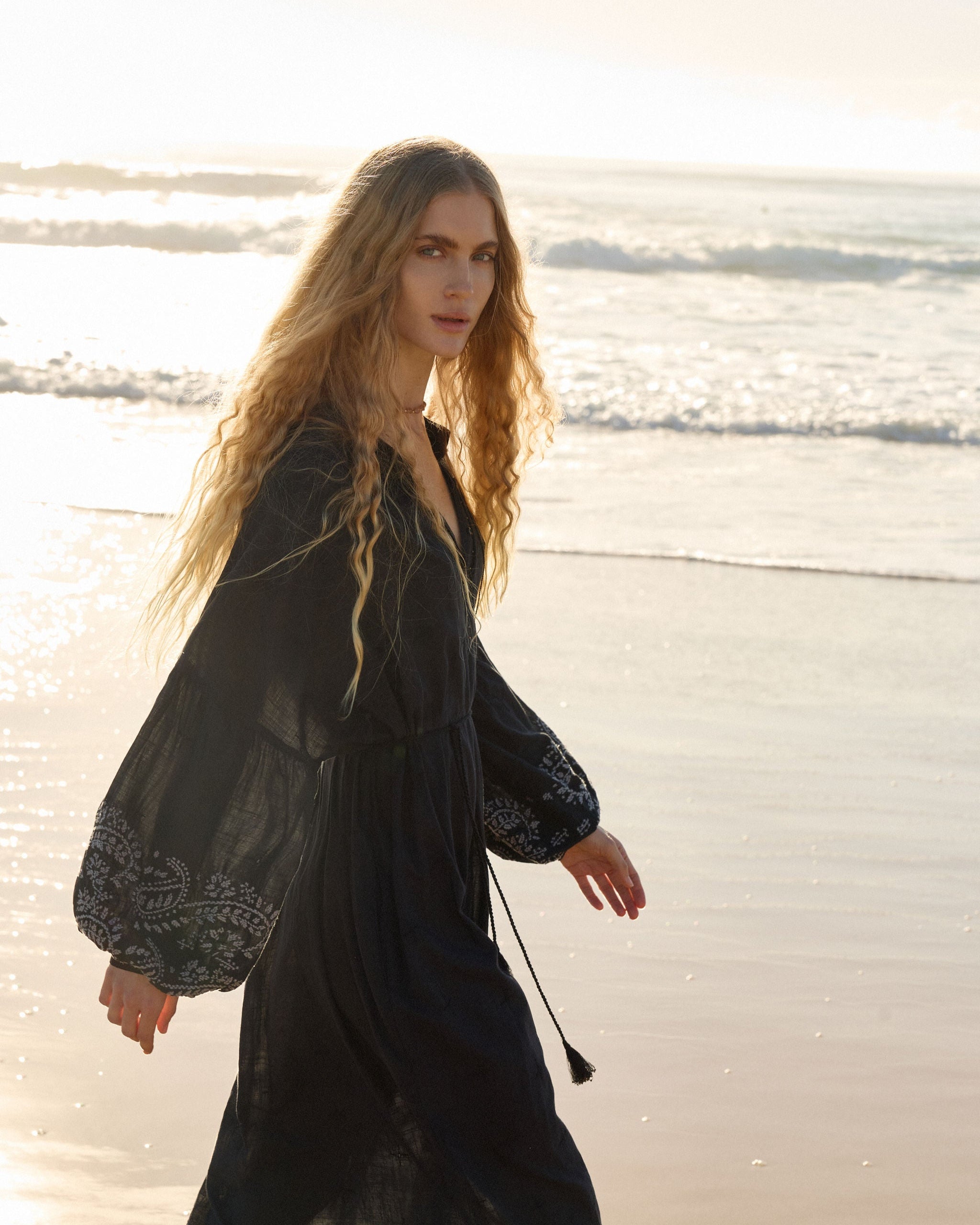 Lakoen Celeste caftan style Dress in black cotton with off white paisley embroidery and full bishop sleeves