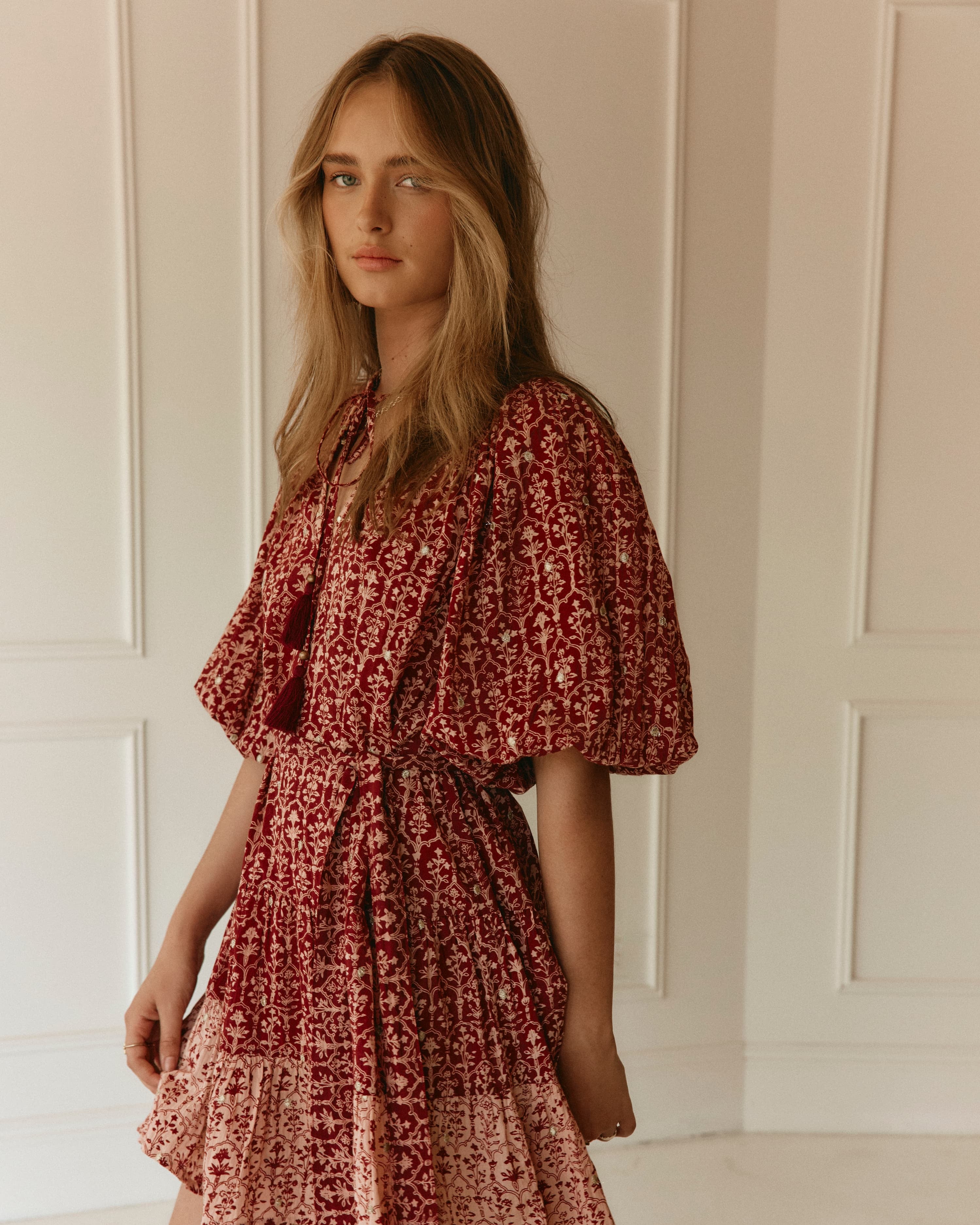 Lakoen model wears our Emile Short dress in soft printed cotton, in rose pink & merlot hues, with delicate gold lurex embroidered dots - slow fashion - hand-crafted - ethically made