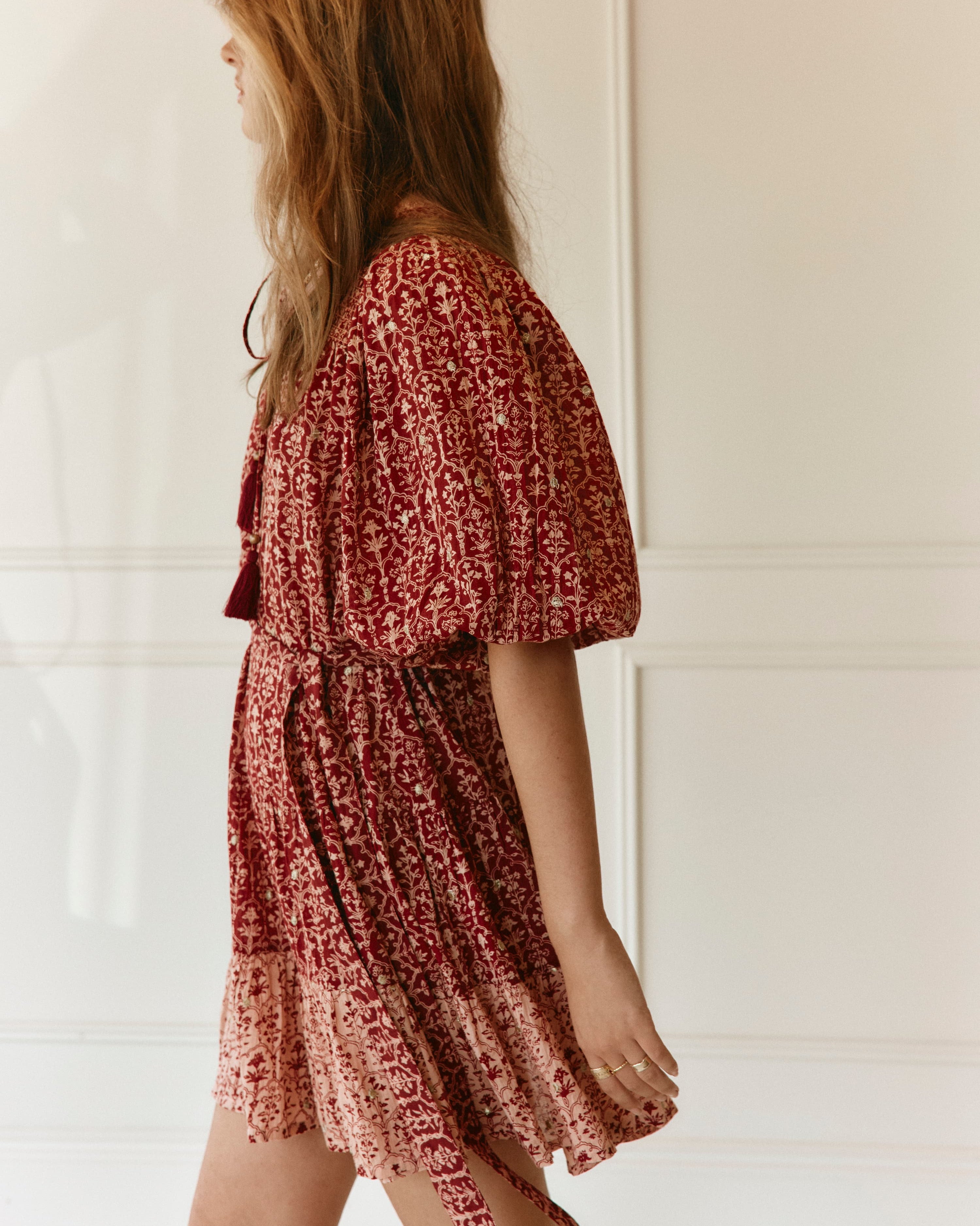 Lakoen model wears our Emile Short dress in soft printed cotton, in rose pink & merlot hues, with delicate gold lurex embroidered dots - slow fashion - hand-crafted - ethically made