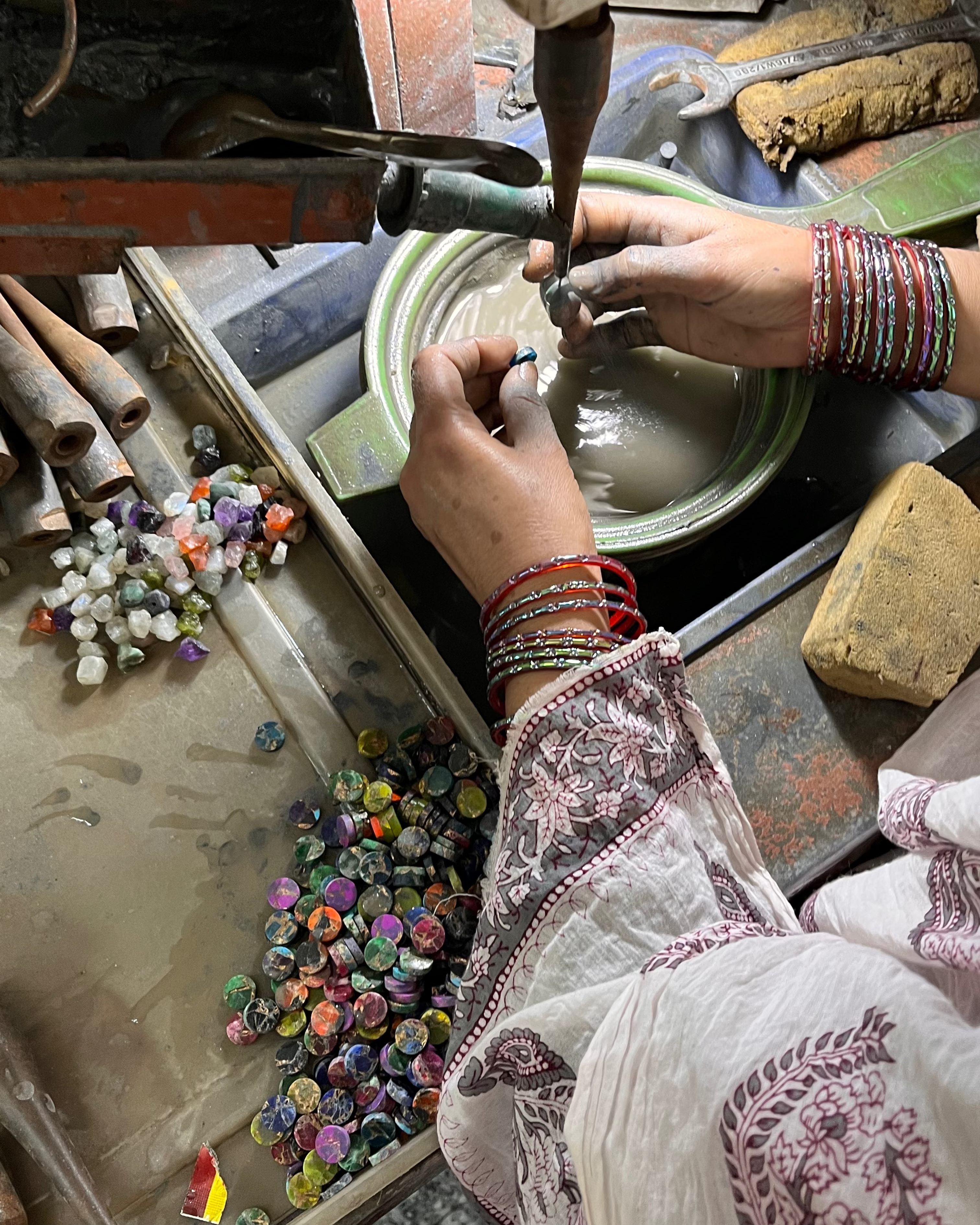 A jeweller polishing gems for LAKOÈN in India. Our Jewellery is ethically made with traditional artisanal techniques, using semi-precious and precious gemstobes set in brass or sterling silver. -Hand-crafted - Slow luxury - Handmade - Bohemian