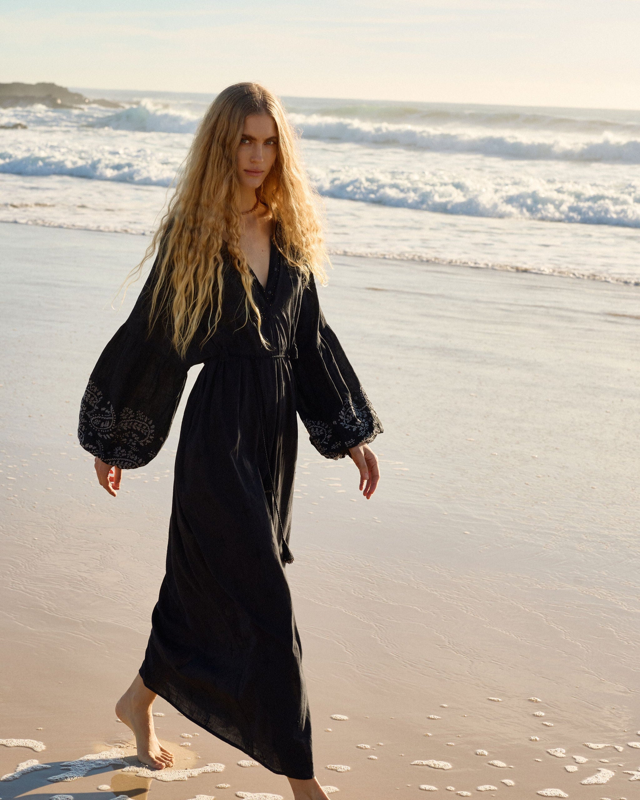 Lakoen Celeste caftan style Dress in black cotton with off white paisley embroidery and full bishop sleeves