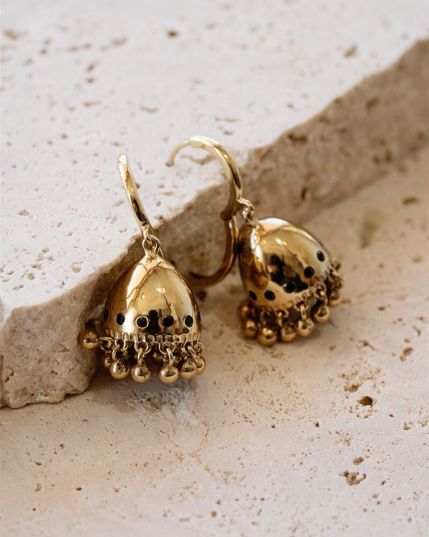 Lakoen Raya Earrings with vintage bell shape  in recycled brass with faceted onyx